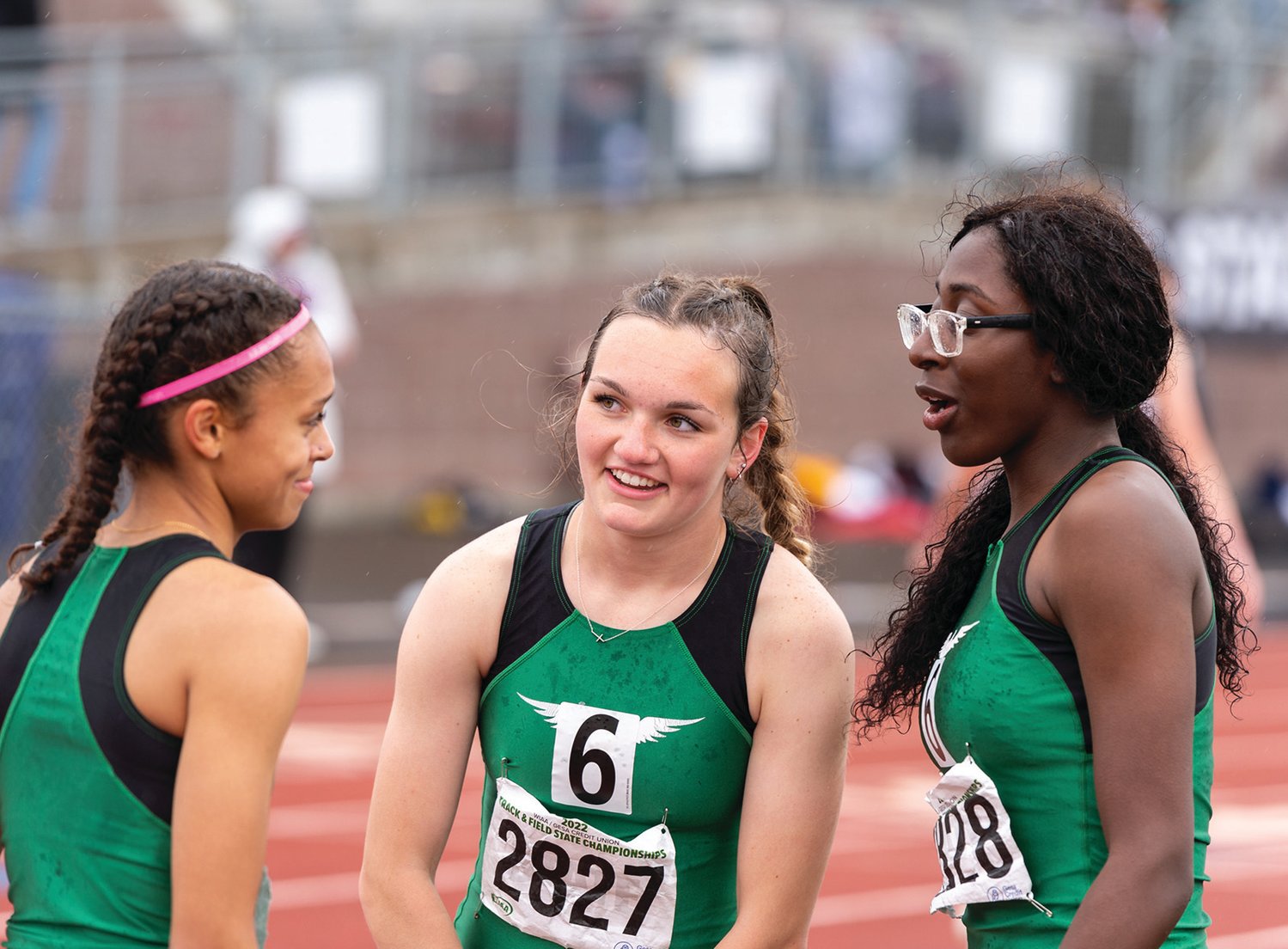 Tumwater's Ava Jones, Reese Heryford and Mariah Jett dissect their third-place run in the 2A Girls 4x400 at the 4A/3A/2A State Track and Field Championships on Saturday, May 28, 2022, at Mount Tahoma High School in Tacoma. (Joshua Hart/For The Chronicle)